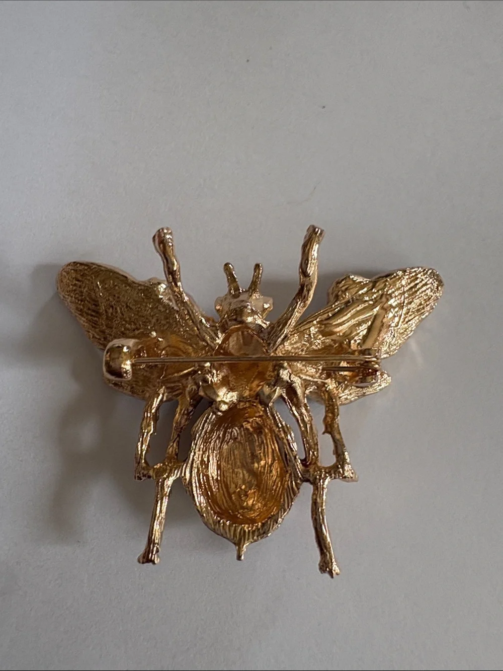 Gold-Tone Bee Brooch with Blue Rhinestones and Purple Enamel Flowers